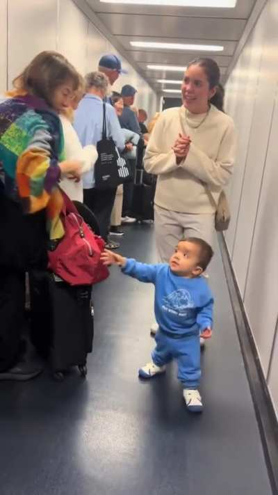 Little CEO greeting his employees?
