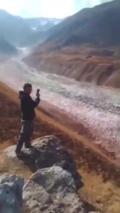On Thursday, an approximately 2-kilometer-long, 25-meter-high, and up to 200-meter-wide section of the Ismoil Somoni Glacier in Tajikistan broke off near Safedobi village, sliding down a gorge. Climate change is driving rising temperatures in Tajikistan,