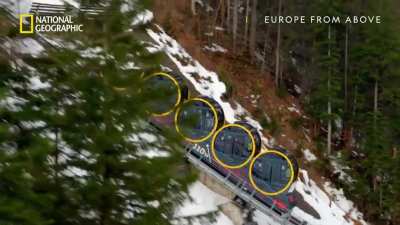 The world's steepest railway in Stoos, Switzerland. Each circular "pod" rotates to keep the floor level as it climbs to a maximum incline of 110%