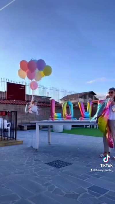 Woman ties her baby with balloons then this happened…