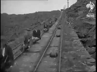 Small truck with handbrake used by quarrie workers to ride in between rails when returning form work in 1935