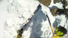 Putting your skis on while on a slope