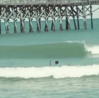 Dude fighting waves