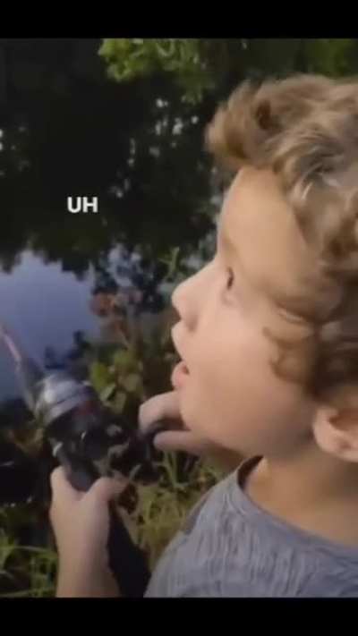 Boy fishing with his dad