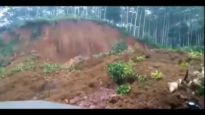 Landslide almost buries motorcycle rider