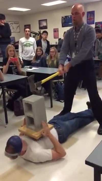 WCGW Trying to hit a brick off of someone's chest
