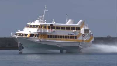 230-seat Boeing 929 Jetfoil arriving at Nishinoomote Port in Japan. The passenger ship is used for high-speed service between Kagoshima and Yakushima and includes 16 premium seats with extra-cushioned seating
