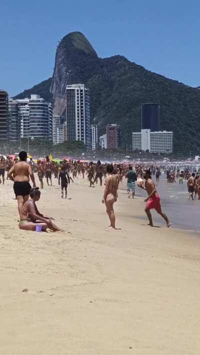 The amount of soccer balls on a Rio de Janeiro beach during a hot day.