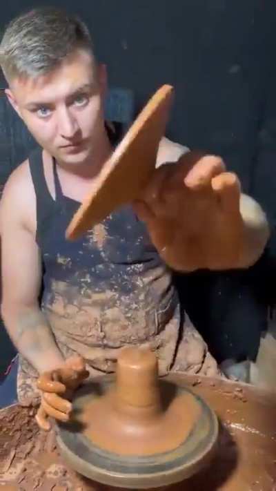 Making a pot out of clay