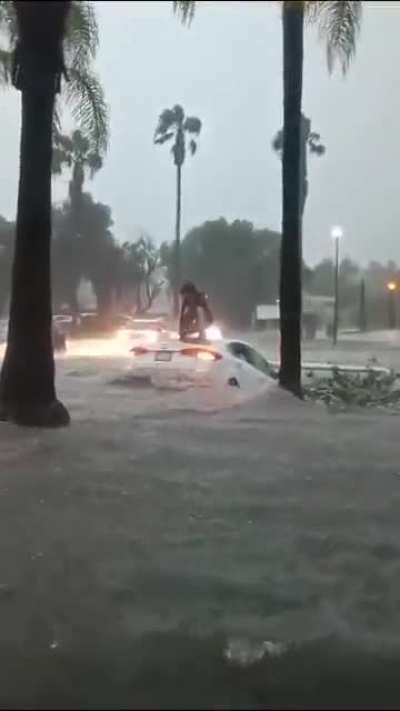 Car pulled by a flood current