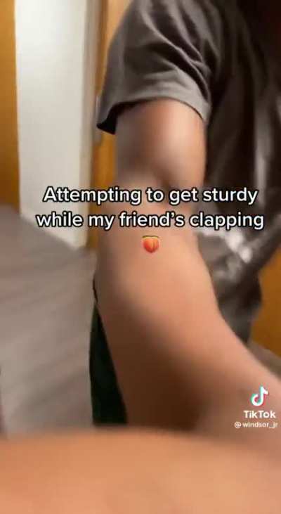 Getting sturdy while his friend is clapping some cheeks