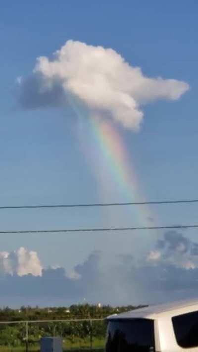 ?Cloud pouring out a rainbow in Falmouth, Jamaica.