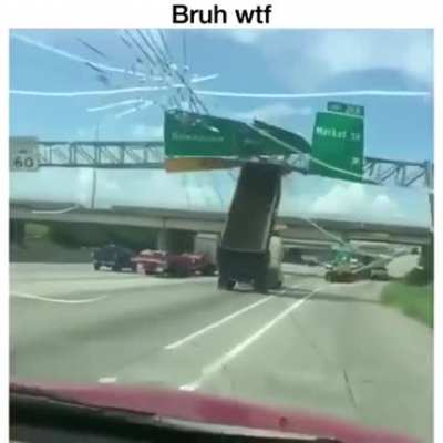 Truck meets sign