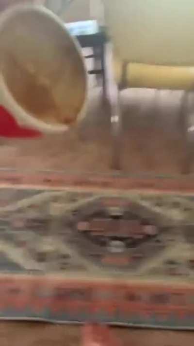 Playing chicken with a cup of coffee over a laptop
