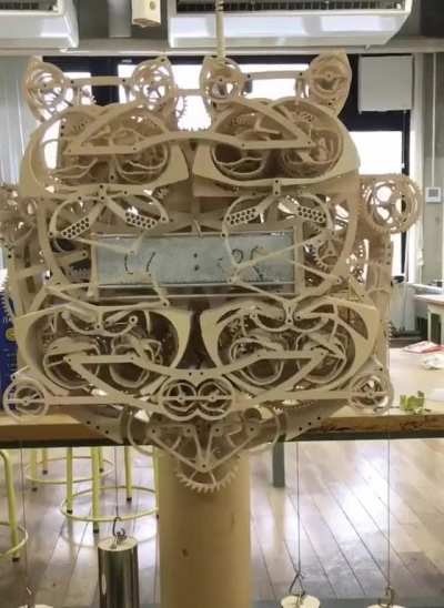 An intricate clock that writes the time out every minute