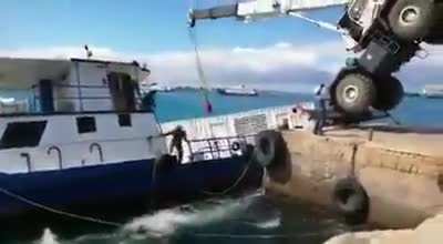 Talk about a bad work day losing your ship, cargo container, and crane all in one day