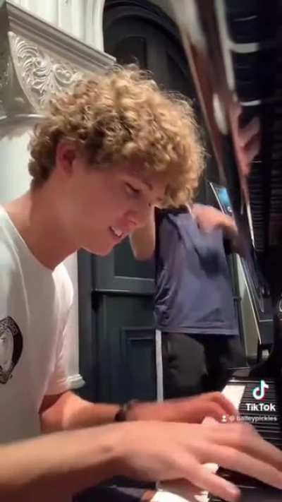 Boy who has never heard Avicii's "The Nights" attempts to play it on piano within seconds of instructions.