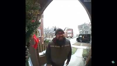Squirrel jumps on delivery mans shoulder.