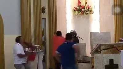 Guy tries to rob a church in the middle of service