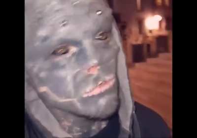 French guy has body modifications to look like a black alien
