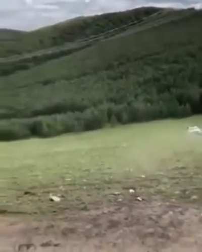 Using front-loader &amp; sling to upright an overturned vehicle, its owner will surely be pleased