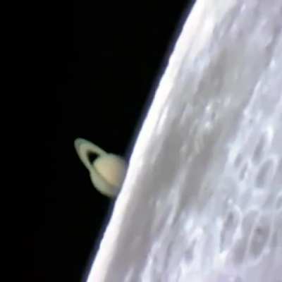 Incredible footage of Saturn rising from behind the Moon during a lunar occultation, captured from a ground-based telescope.