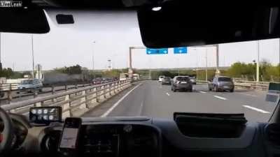 biker escorts ambulance during traffic