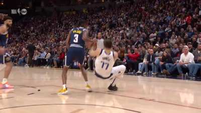 [Highlight] Bones Hyland unsuccessfully pulls the chair as Luka Doncic hits the ground hard and gingerly gets up