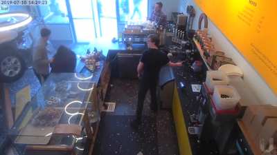 SUV crashes into donut shop