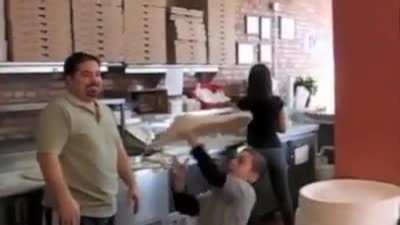 guy shows his tricks with pizza dough