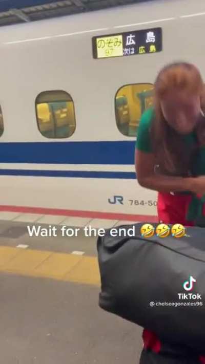 Mexico's Olympic Softball team celebrates getting off a Japanese bullet train before it takes off with one of its members? 22 people, 45 bags