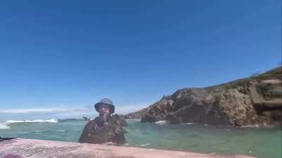 Two Australian paddleboarders saved an exhausted wallaby that had been swept out to sea