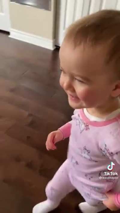 This toddler is very happy to have her dad home