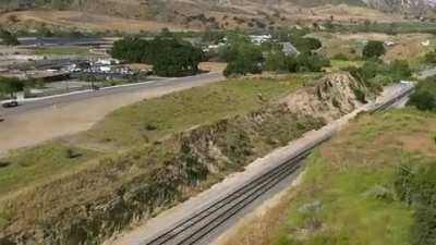 Motorcycle Rider Jumps Train Tracks As He Evades Police