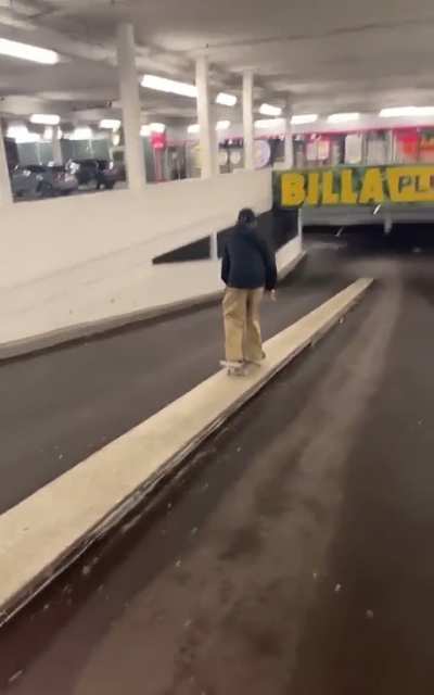 skating down a ramp in a parking lot