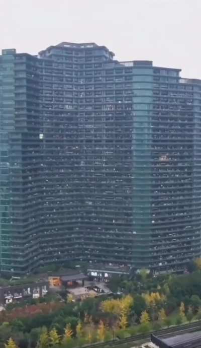 The Regent International apartment building in China is home to around 20k people. The building is 206 meters tall and has 36 to 39 floors, a giant food court, as well as swimming pools, barber shops, nail salons, medium-sized supermarkets, and internet c