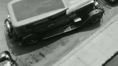A fifth wheel is used to help parallel park in 1933.
