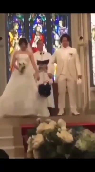 ? Little boy is checking how strong, this marriage will be?