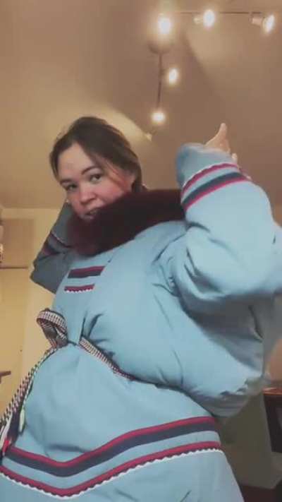 kiddo packed inside Inuit mom's coat ?