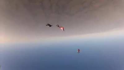 Two skydivers collide mid-air, knocking one of them unconscious. Camera man proceeds to pulls some mission impossible shit and saves his life.