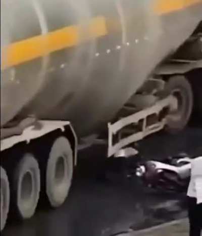 Dude narrowly escaped getting his head crushed by a truck.