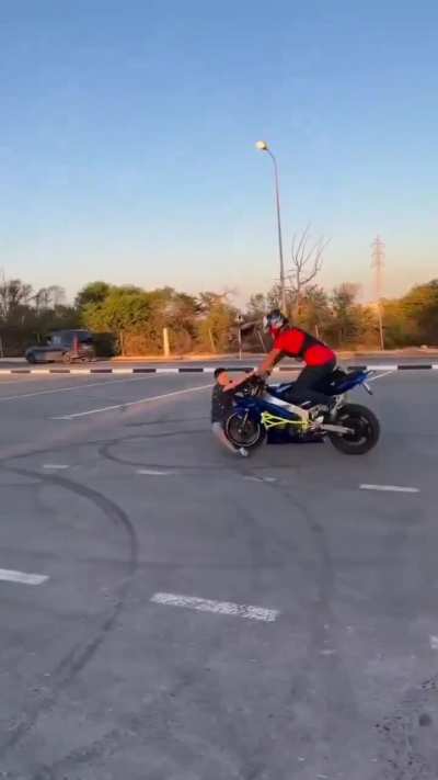 WCGW popping a wheelie with someone on the front of the bike