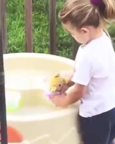 Just giving the doll a bath