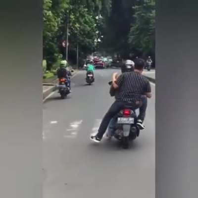 Grabs a stranger for the chase with the rest in tow.