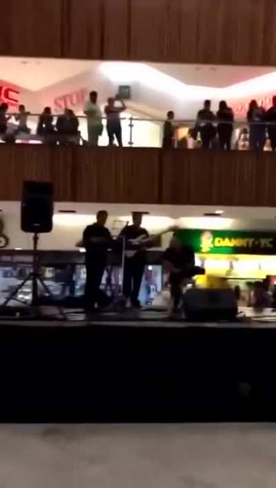 The mall started flooding so the live band starts to perform the Titanic song