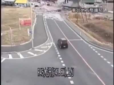 The catastrophic destruction a Tsunami caused by the Tohoku earthquake in 2011