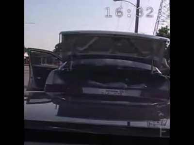 Policemen accidentally hits a car in front of him.