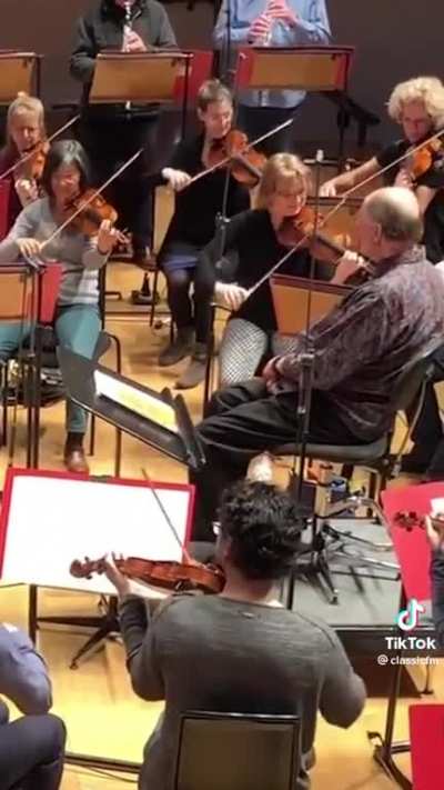 Orchestra pranks their conductor with a beautiful arrangement of "Happy Birthday"