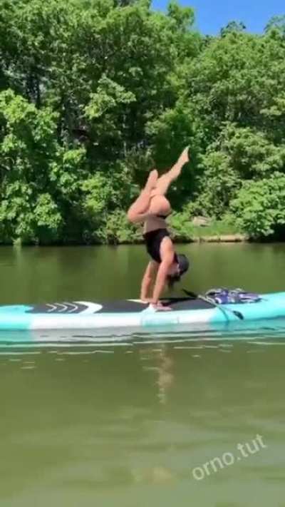 Hmc while I try to do a trick on a paddle board
