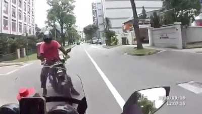 Idiot biker causing Head on collision
